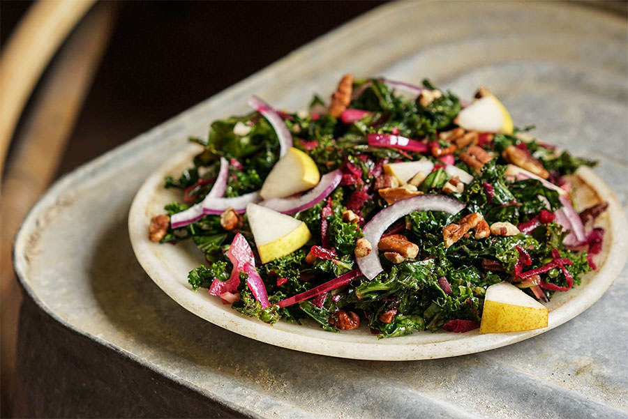 Kale salad with pear and walnuts
